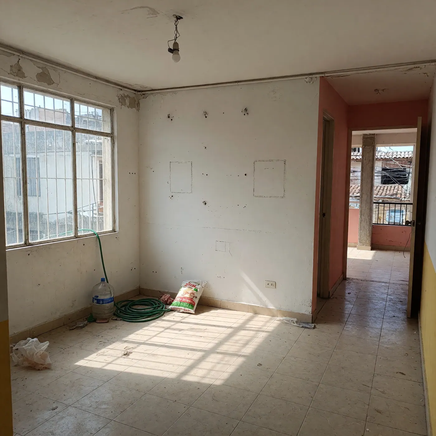 Empty unfurnished Colombian apartment showing bait-and-switch rental situation