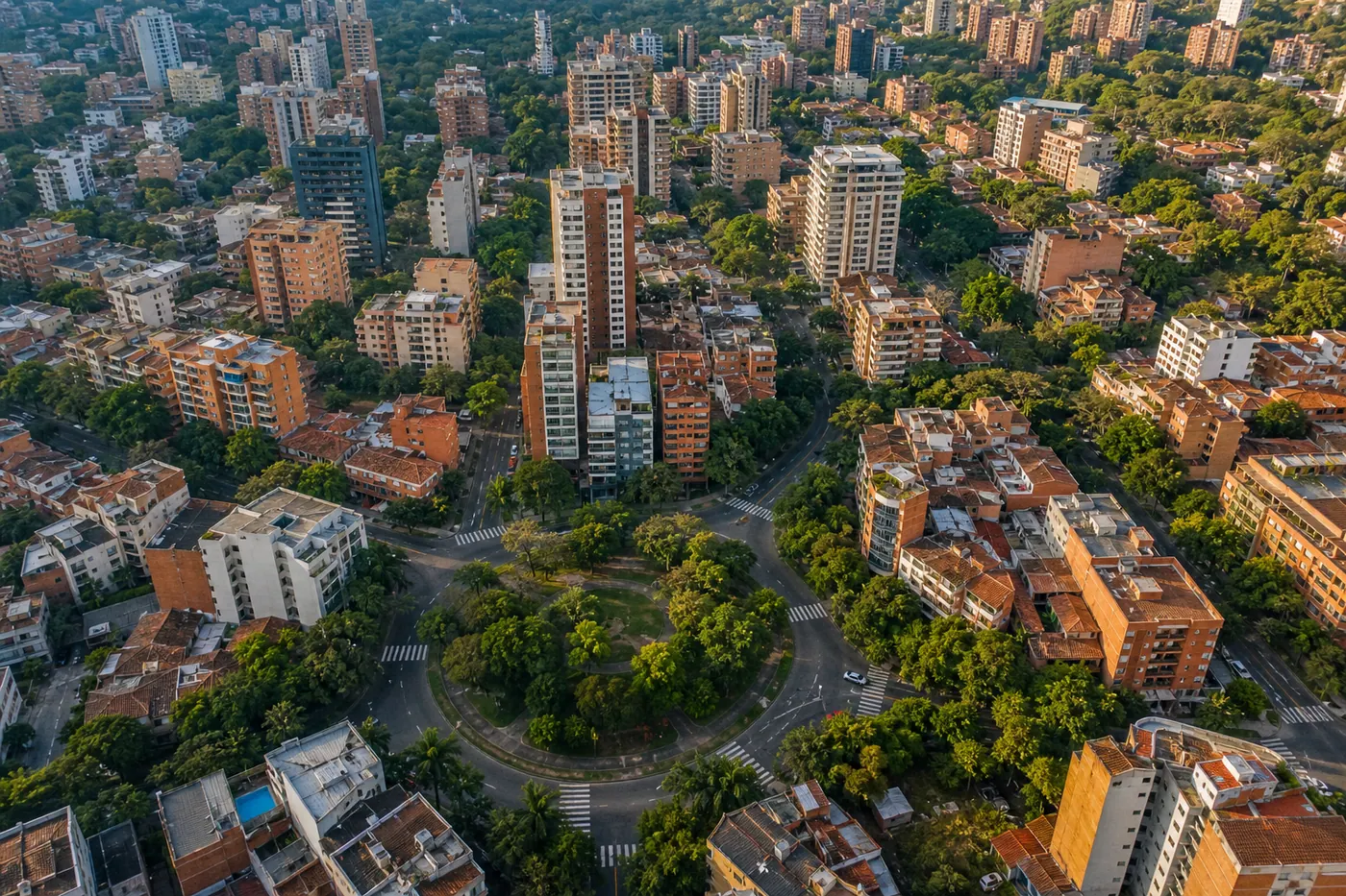 Aerial view of Laureles neighborhood in Medellín, Colombia, with tree-lined circular streets and residential buildings