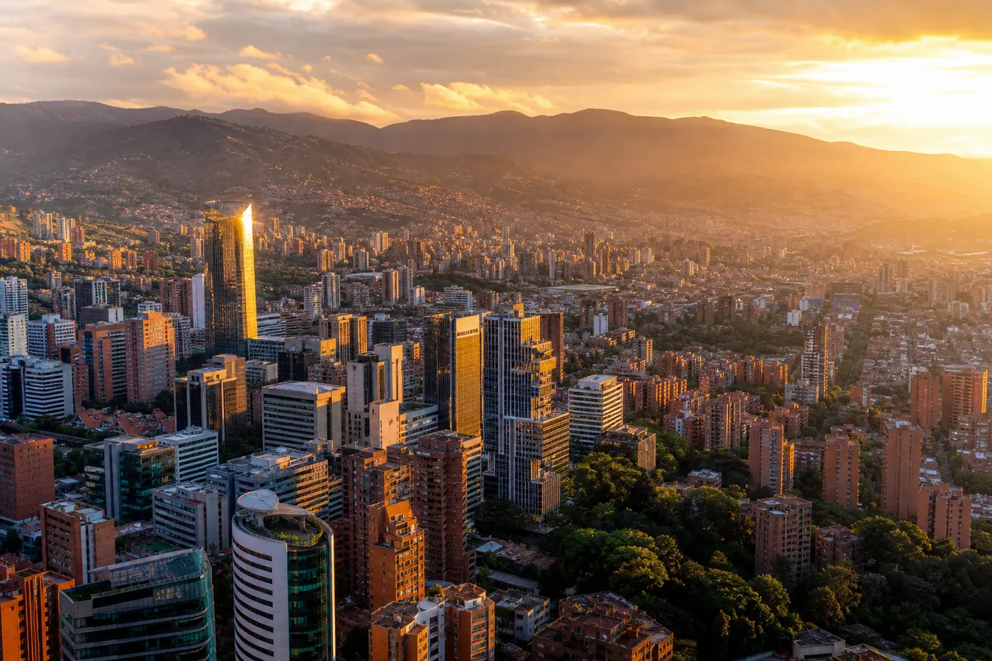 Aerial view of Medellín Colombia at golden hour, modern city and mountains